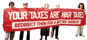 five people holding long red banner: "Your Taxes are War Taxes: Redirect Them for a Better World!"