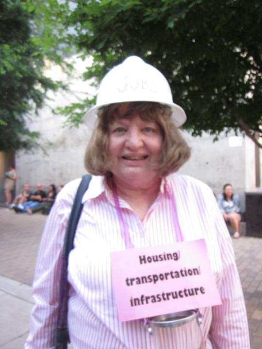 Woman in hard-hat, labeled “Housing, transportation, infrastructure”