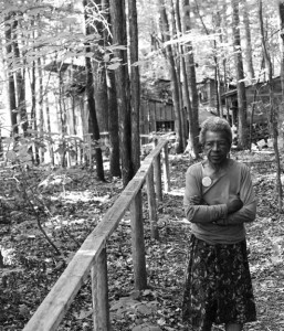 Juanita at Woolman Hill, September 2007. The house she shared for many years with Wally is in the background. Photo by Ed Hedemann.