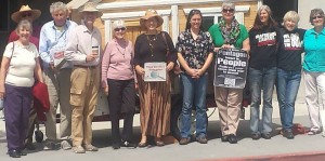 ten people pose for the camera at the Southern California war tax redirection ceremony and press conference in San Diego