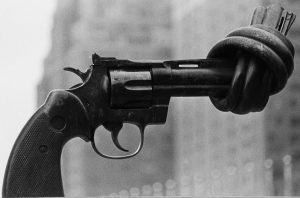 image of a pistol with the end tied in a knot