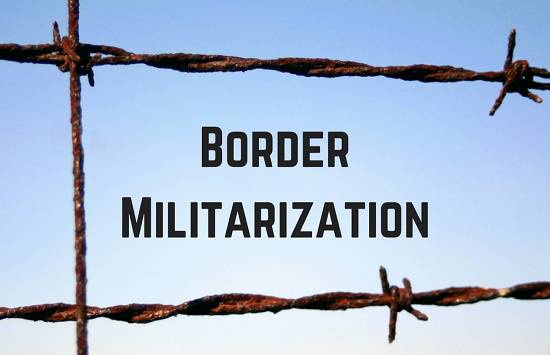 barbed wire fence with text "Border Militarization" displayed between two rows of wire