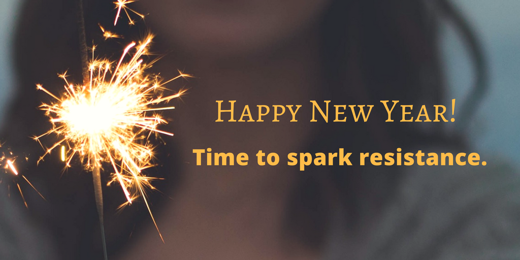 photo of a sparkler with the words "Happy New Year! Time to spark resistance."