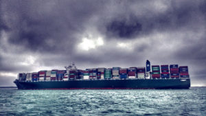 image of a container ship loaded up at sea