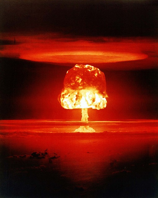 Image of nuclear weapons explosion on horizon with orange glow