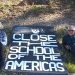 Close the School of the Americas banner with woman and man on both sides