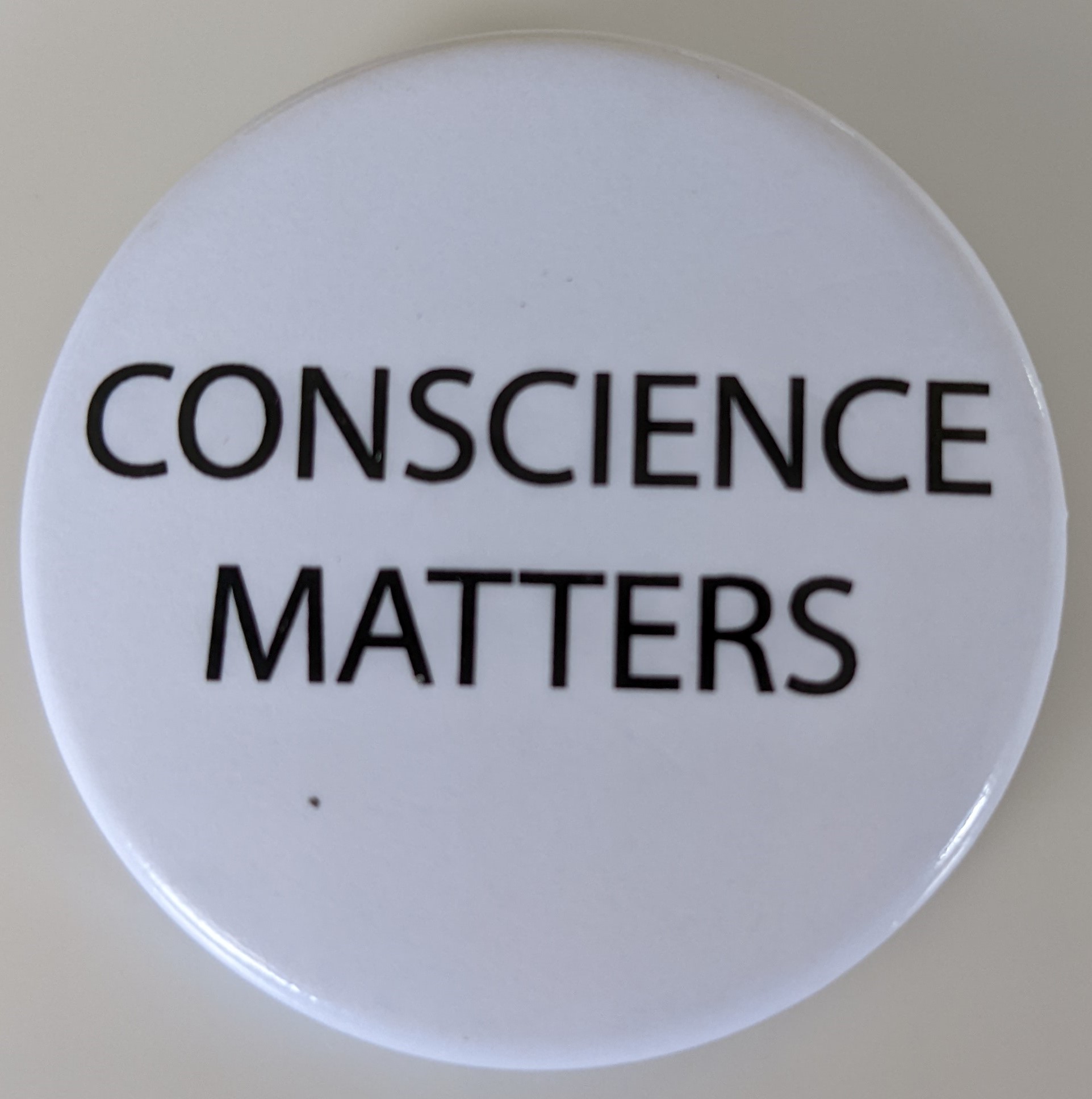 Pin that states: Conscience Matters