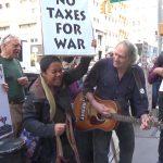 singing away war at tax day protest