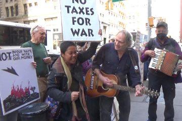 singing away war at tax day protest