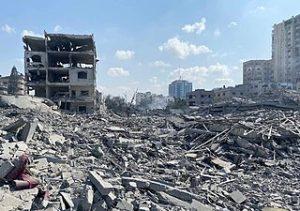 Multistory building on left and right frame of the photo. Blue sky with white clouds in the background and rubble between the buildings from previous buildings that were destroyed.