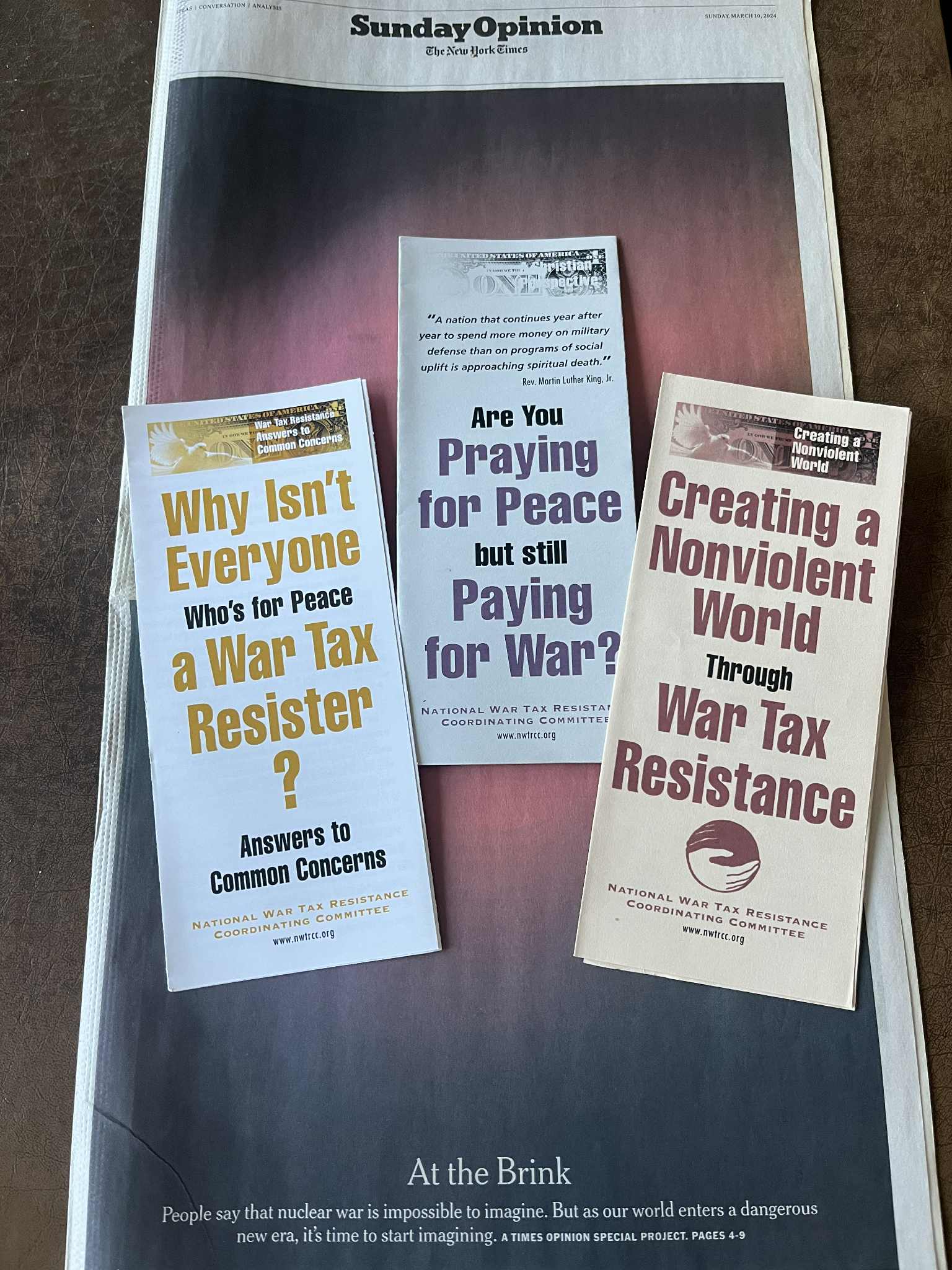 At the Brink New York Times series with NWTRCC pamphlets photo by Chrissy Kirchhoefer